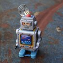 Robot tin toy spaceman astronaut with tool tin robot